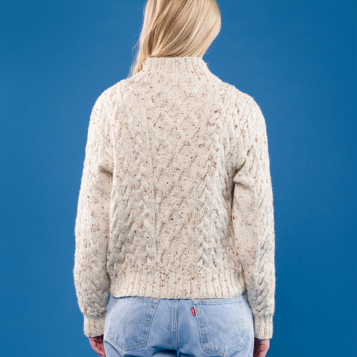 Floral Medallions Knit Pullover made using Caron yarn in a styled lifestyle setting