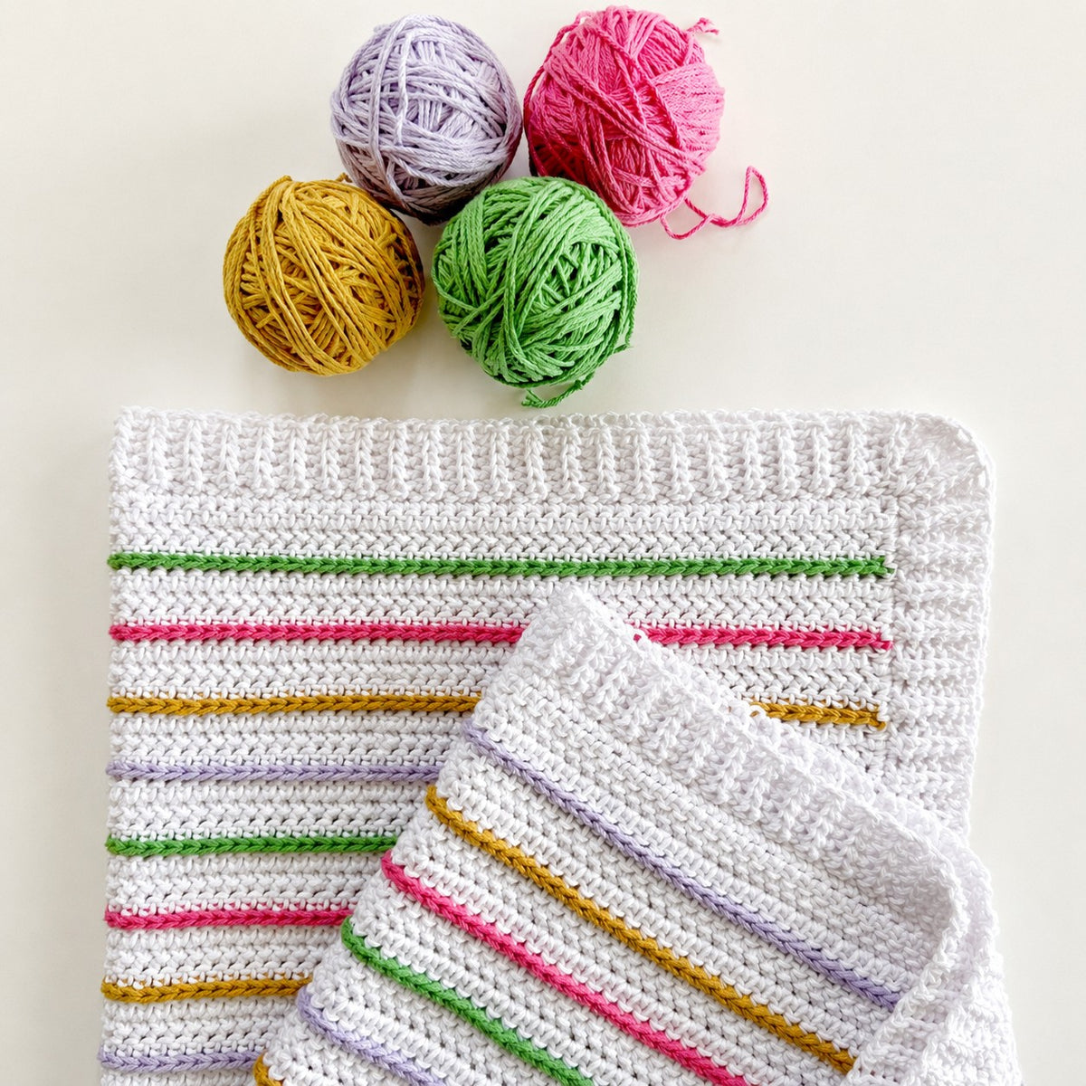 Bloom Stipes Blanket made using Cotton yarn in a styled lifestyle setting