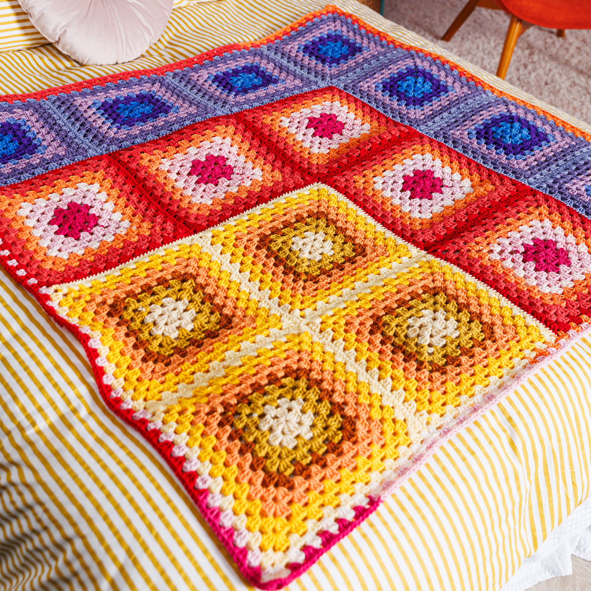 Crochet Sunset Corner Blanket made using Red Heart yarn
