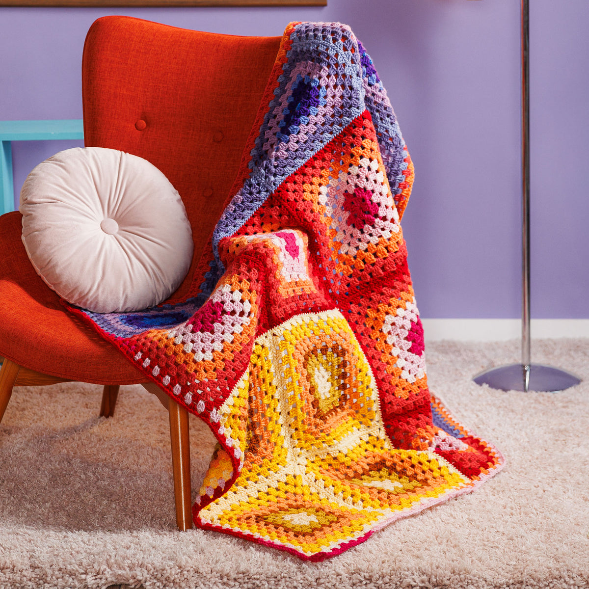 Crochet Sunset Corner Blanket made using Red Heart yarn