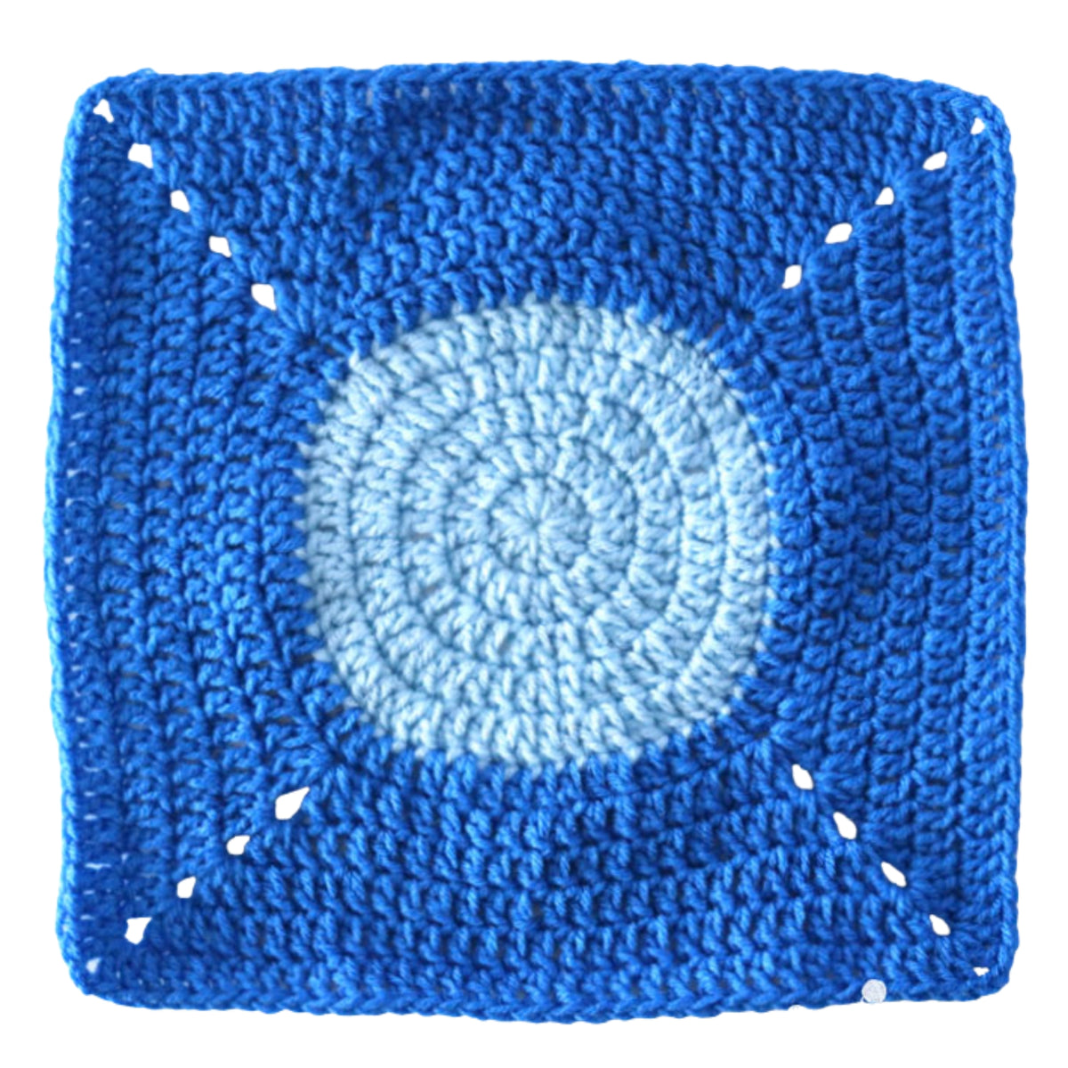Under The Sea Crochet Blanket made using Red Heart yarn in a styled lifestyle setting