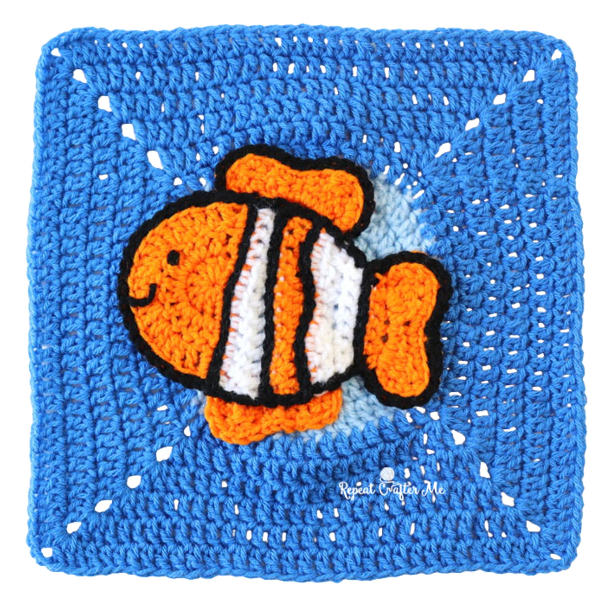 Under The Sea Crochet Blanket made using Red Heart yarn in a styled lifestyle setting