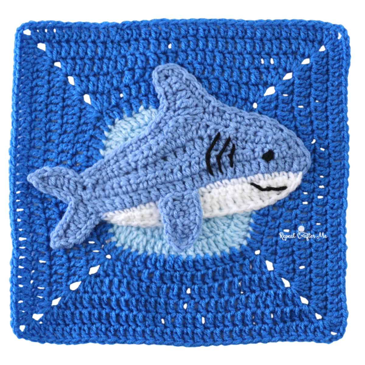 Under The Sea Crochet Blanket made using Red Heart yarn in a styled lifestyle setting