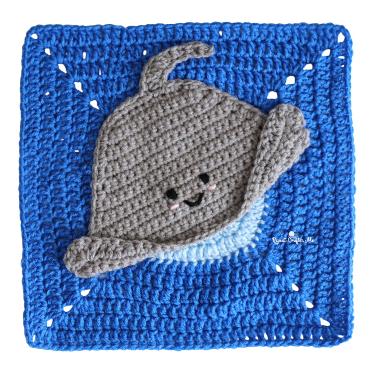Under The Sea Crochet Blanket made using Red Heart yarn in a styled lifestyle setting