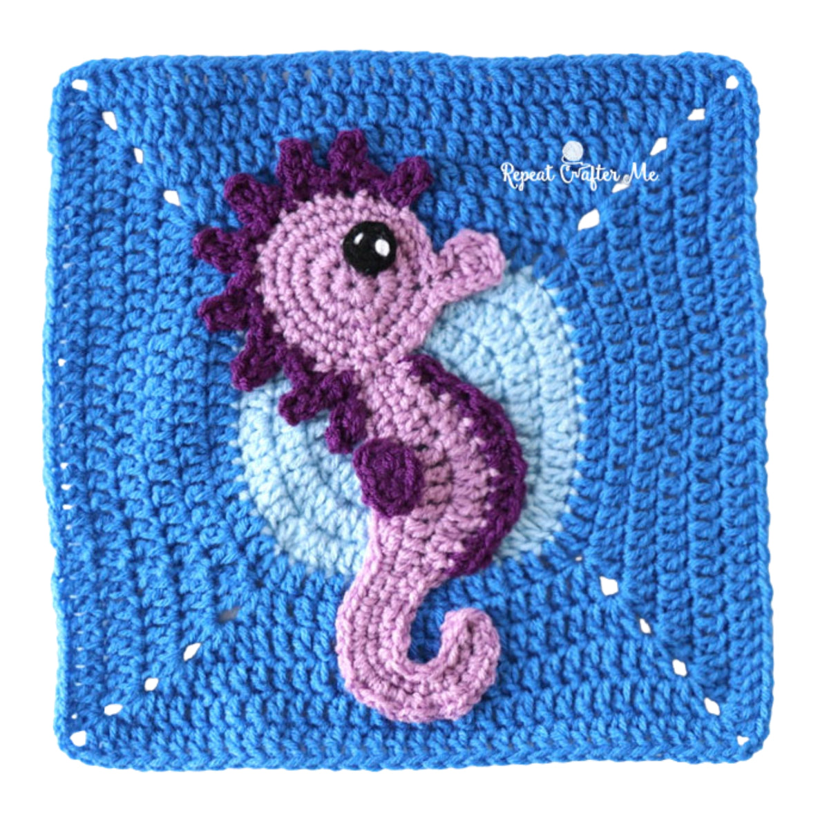 Under The Sea Crochet Blanket made using Red Heart yarn in a styled lifestyle setting