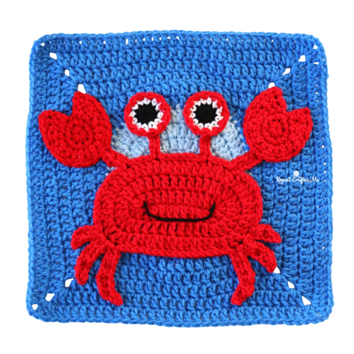 Under The Sea Crochet Blanket made using Red Heart yarn in a styled lifestyle setting