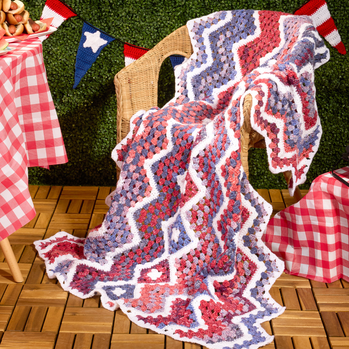 Crochet Firework Throw made using Red Heart yarn in a styled lifestyle setting