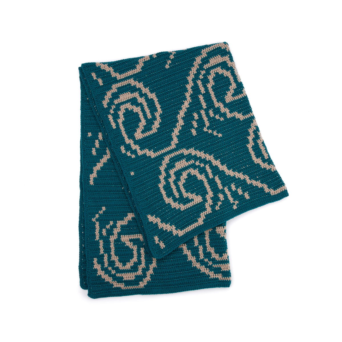 It'S Just A Wave Crochet Blanket made using Red Heart yarn in a styled lifestyle setting
