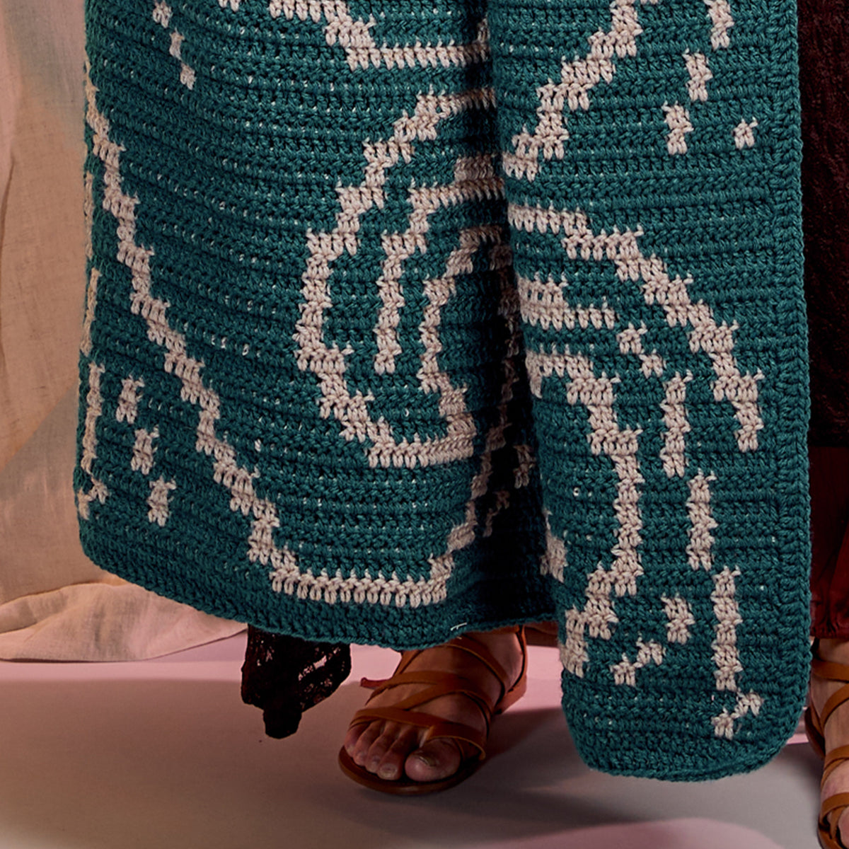 It'S Just A Wave Crochet Blanket made using Red Heart yarn in a styled lifestyle setting