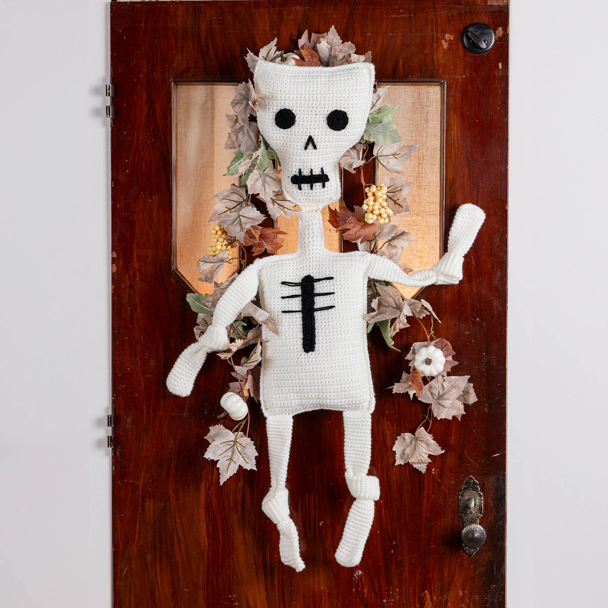 Crochet Mr. Bones Skeleton Pillow made using Red Heart yarn