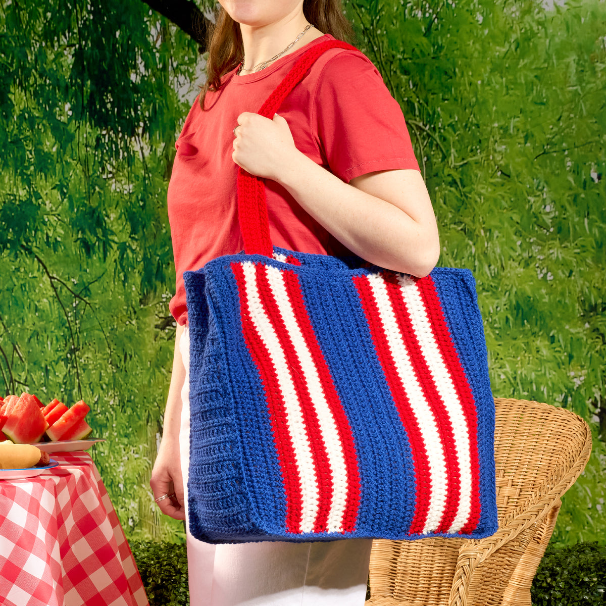 Beachside Stripes Crochet Bag made using Red Heart yarn in a styled lifestyle setting