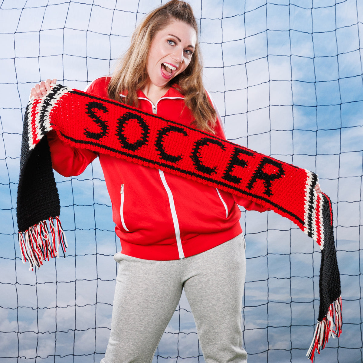 Team Pride Crochet Scarf made using Red Heart yarn in a styled lifestyle setting