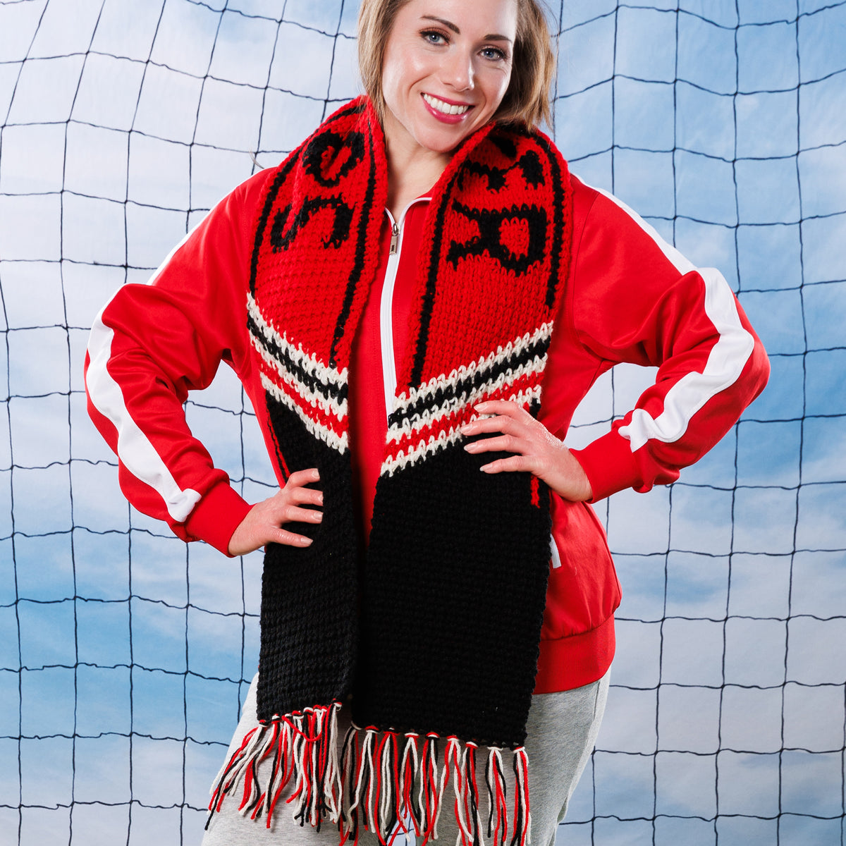 Team Pride Crochet Scarf made using Red Heart yarn in a styled lifestyle setting