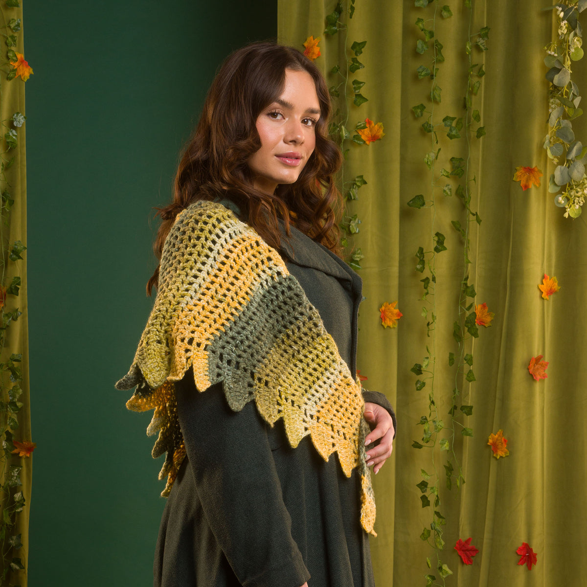 Dragon’S Hoard Crochet Shawl made using Red Heart yarn in a styled lifestyle setting