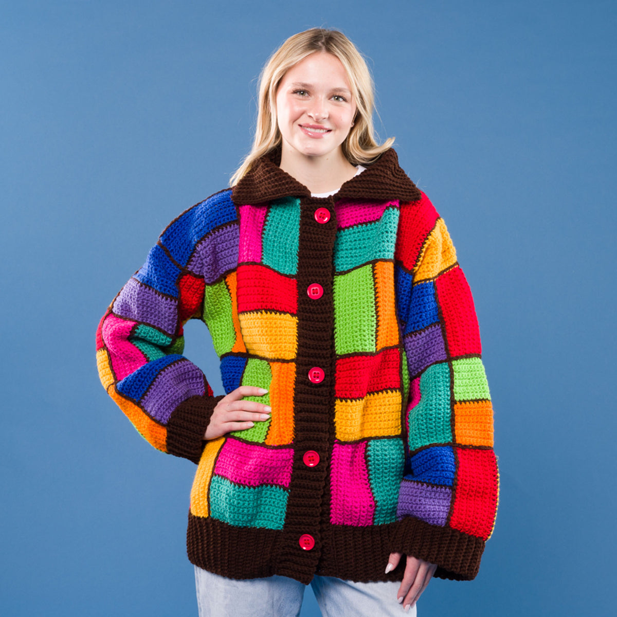 Parque Colors Crochet Cardigan made using Red Heart yarn in a styled lifestyle setting