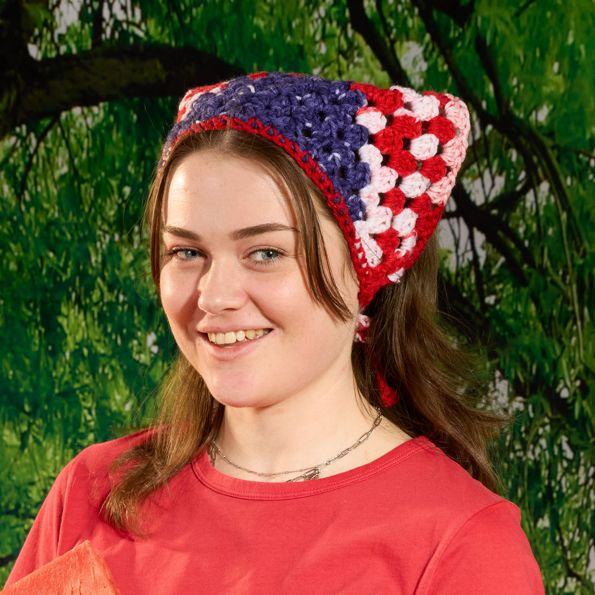 Crochet Star Spangled Bandana made using Red Heart yarn in a styled lifestyle setting