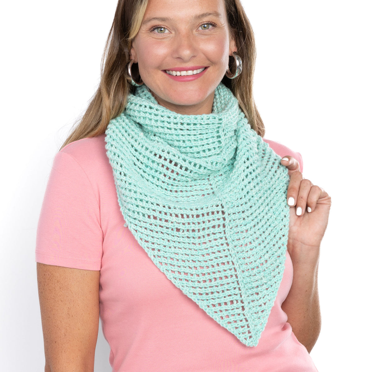Cool Breeze Knit Shawl made using Red Heart yarn in a styled lifestyle setting