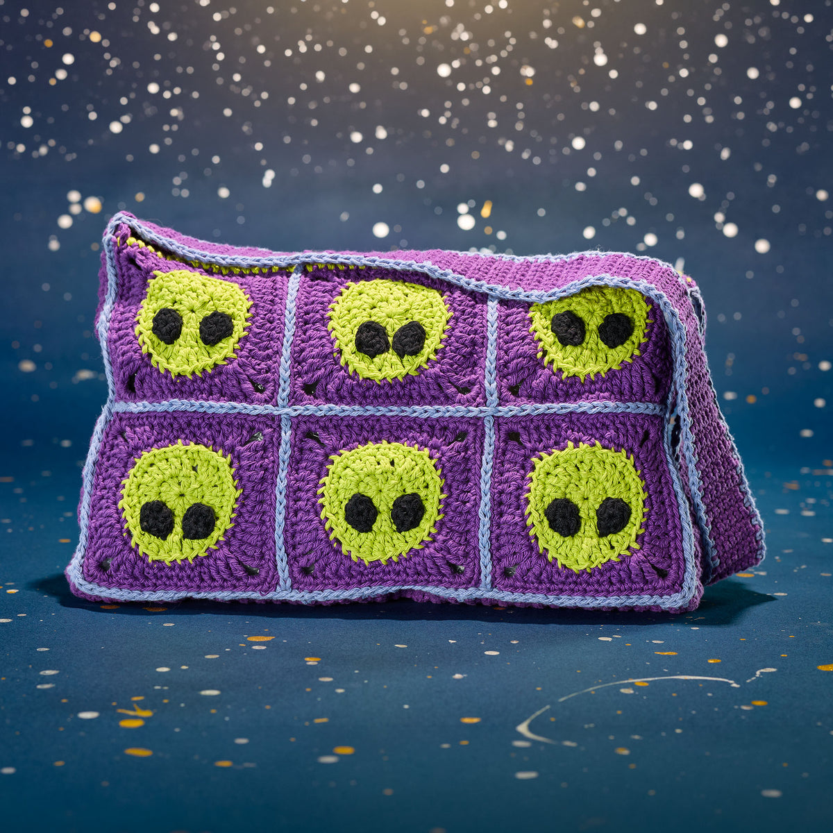Crochet Extraterrestrial Messenger Bag made using Lily yarn in a styled lifestyle setting