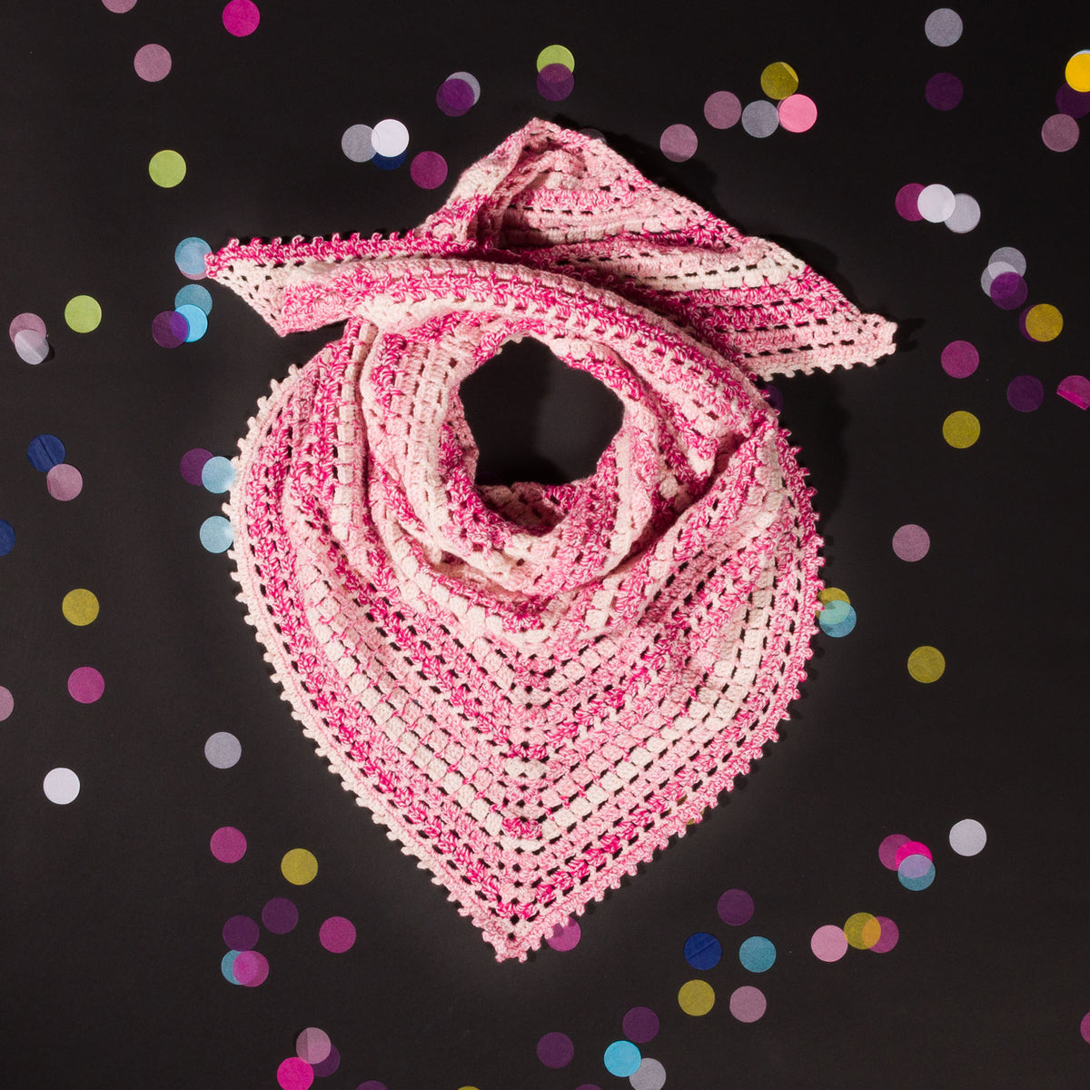 A crocheted shawl with a gradient of blue to purple colors, featuring a picot edging,Lollipop Pink