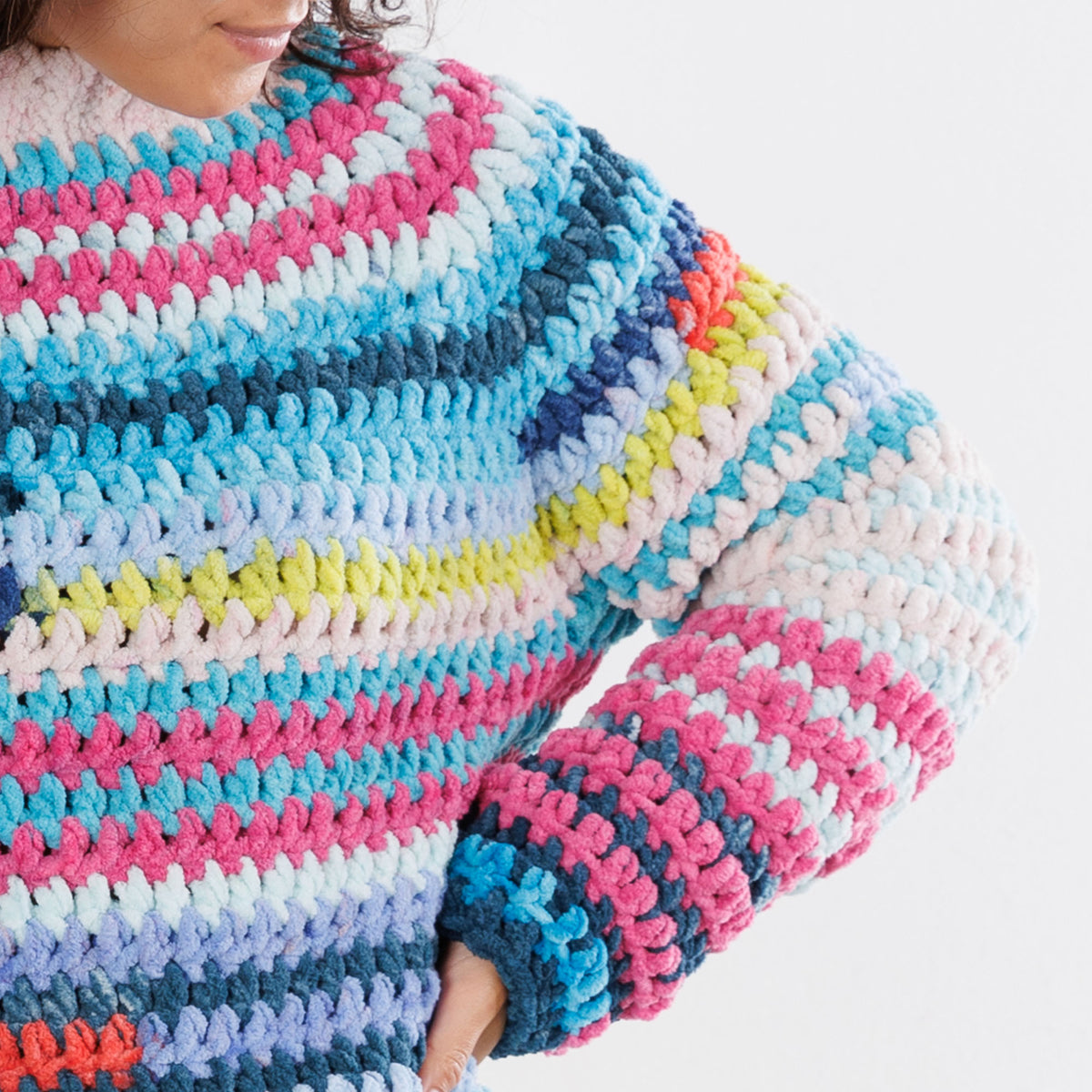 Patchwork Crochet Pullover made using Bernat yarn in a styled lifestyle setting