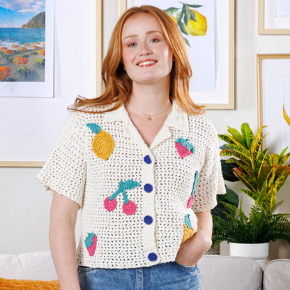 Bernat Crochet Fruit Bowl Camp Shirt Crochet Fruit Bowl Camp Shirt made using Bernat yarn in a styled lifestyle setting
