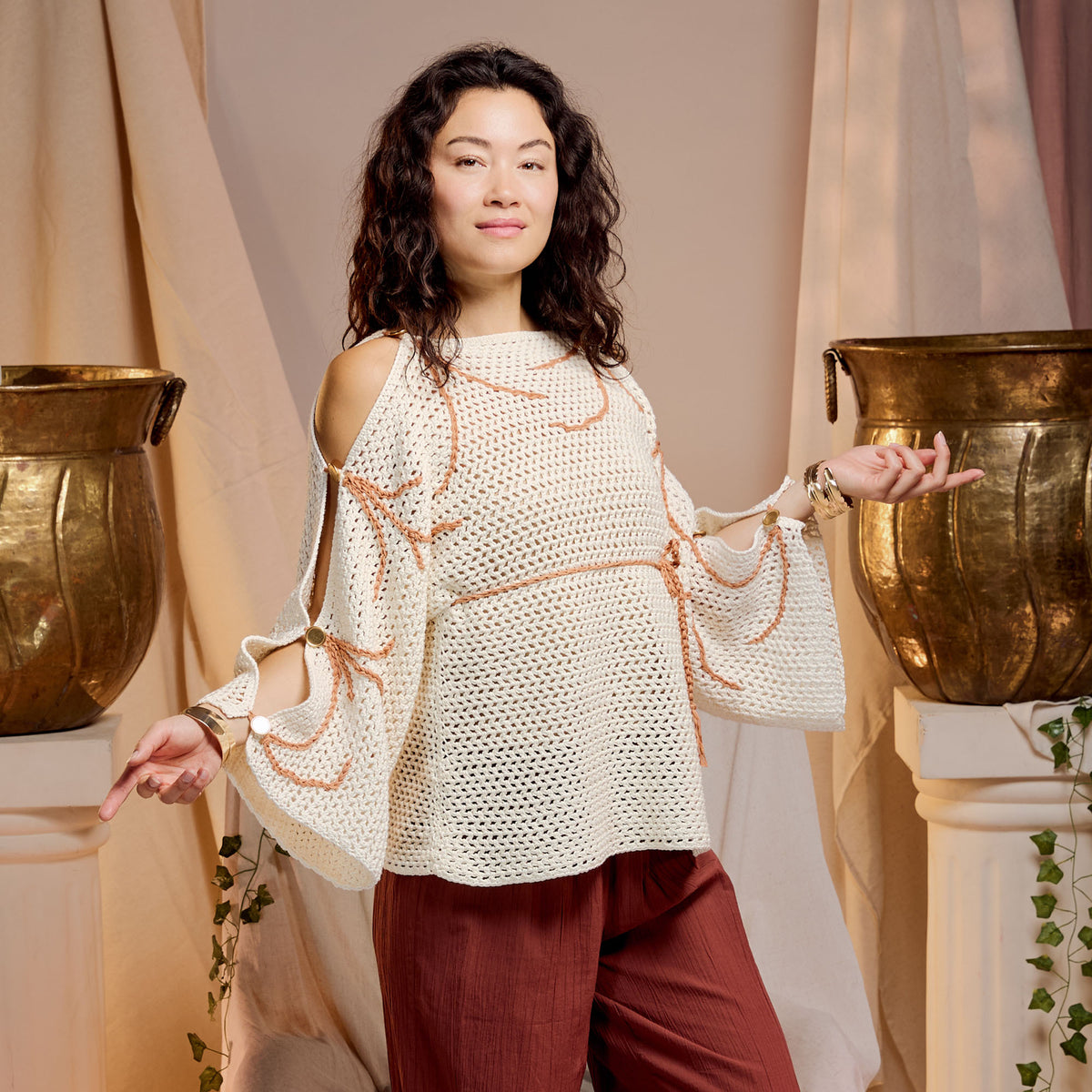 Crochet Grecian Top made using Bernat yarn in a styled lifestyle setting
