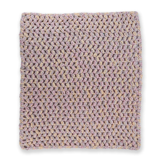 Puffs A Plenty Crochet Baby Blanket made using Bernat yarn on a white background