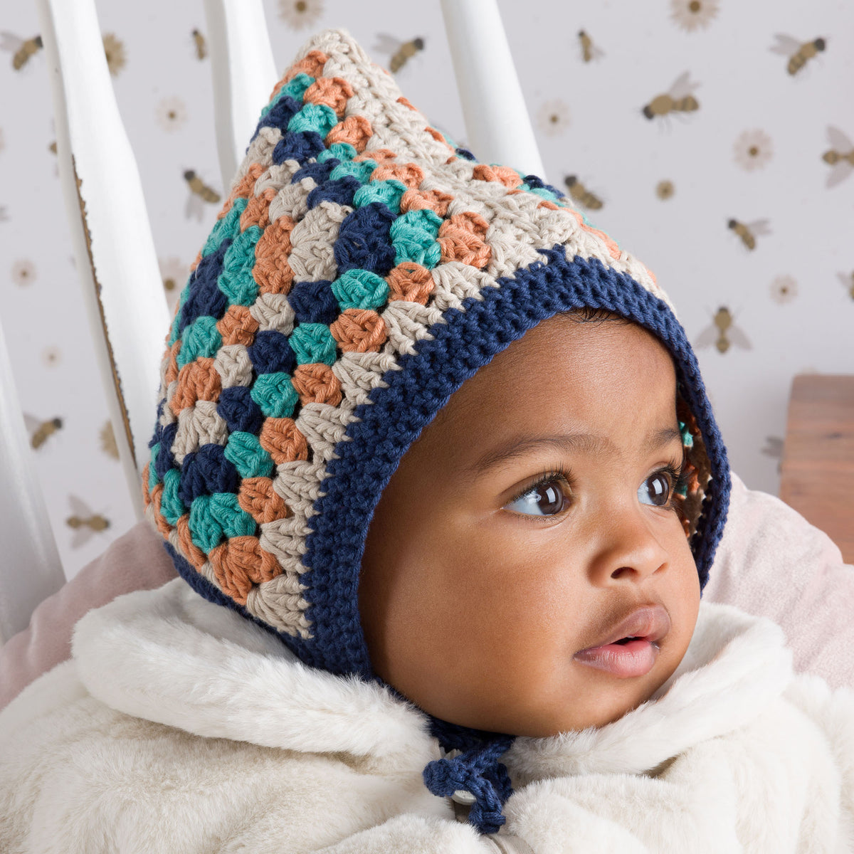 Crochet Granny Square Baby Bonnet made using Bernat yarn