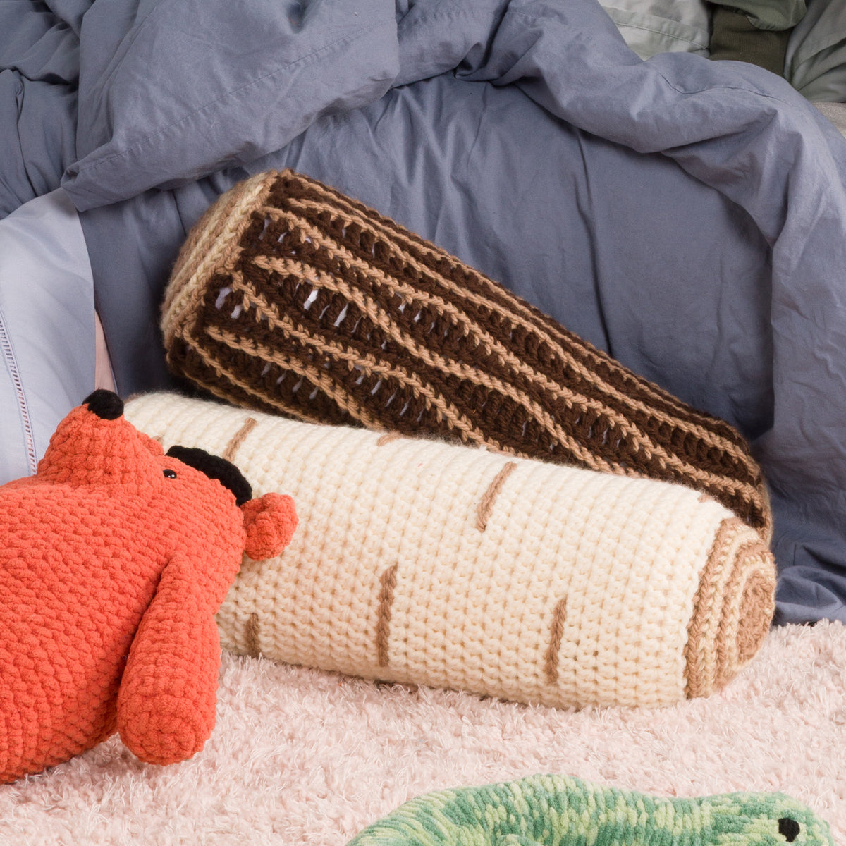 A crocheted beige and brown timber-like pillow or pouf,All Variants