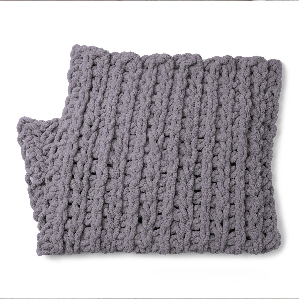 Ridge & Repeat Crochet Throw made using Bernat yarn on a white background