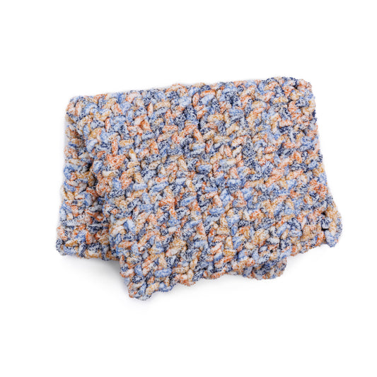 Big textured crochet blanket made using Bernat yarn.