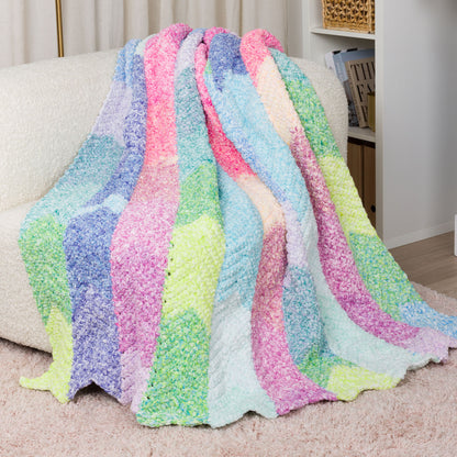Bernat Color Cascade Crochet Blanket Color Cascade Crochet Blanket made using Bernat yarn in a styled lifestyle setting