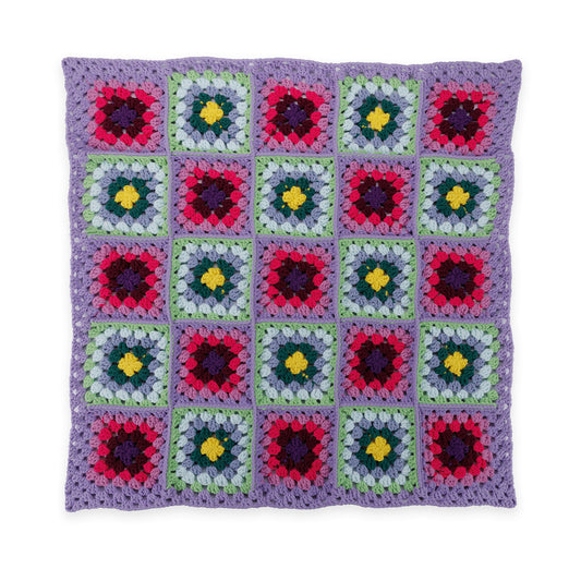 Fair And Square Crochet Blanket made using Bernat yarn in a styled lifestyle setting