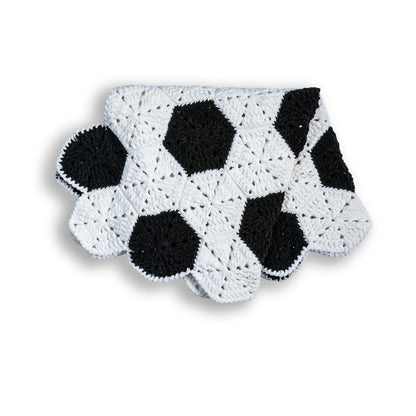 Bernat Crochet Soccer Ball Blanket Crochet Soccer Ball Blanket made using Bernat yarn in a styled lifestyle setting