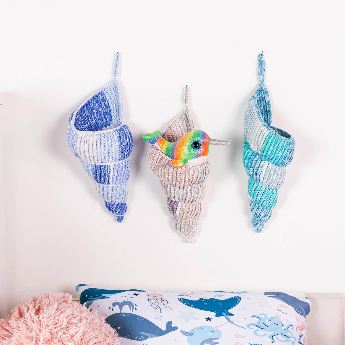 Crochet Conch Shell Hanging Basket made from Bernat Maker Splash yarn.