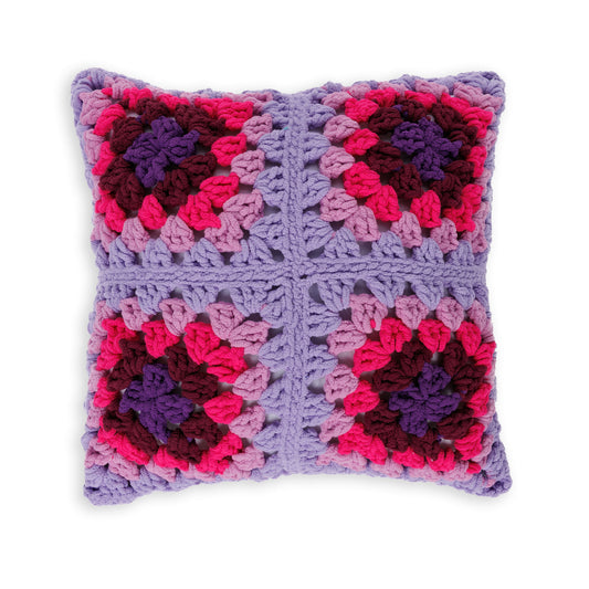 Perfectly Plush Crochet Pillow made using Bernat yarn on a white background