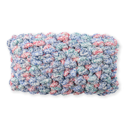 Bernat Quick Crochet Lumbar Pillow Quick Crochet Lumbar Pillow made using Bernat yarn in a styled lifestyle setting