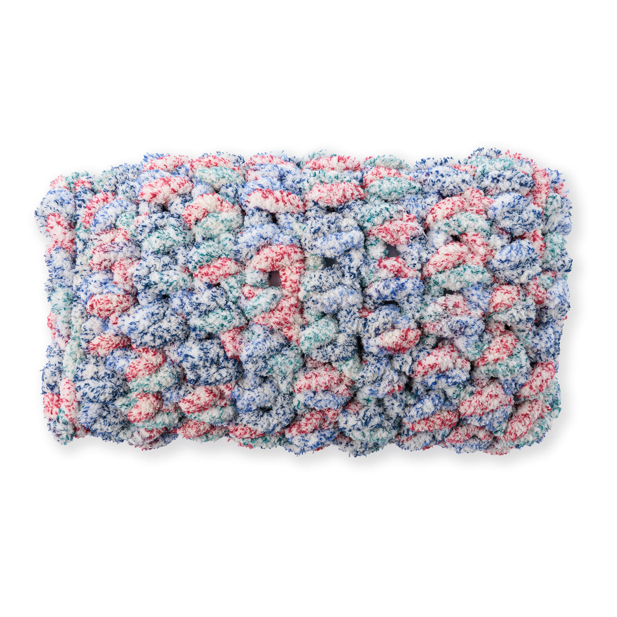Quick Crochet Lumbar Pillow made using Bernat yarn on a white background
