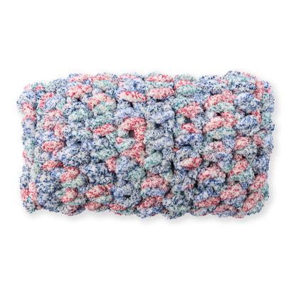 Bernat Quick Crochet Lumbar Pillow Quick Crochet Lumbar Pillow made using Bernat yarn on a white background