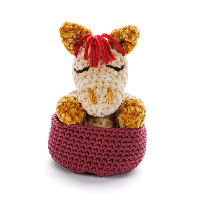 Bernat Sleeping Foal to Crochet Sleeping Foal To Crochet made using Bernat yarn on a white background