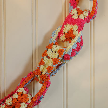 Bernat Crochet Granny Chain Garland Crochet Granny Chain Garland made using Bernat yarn in a styled lifestyle setting