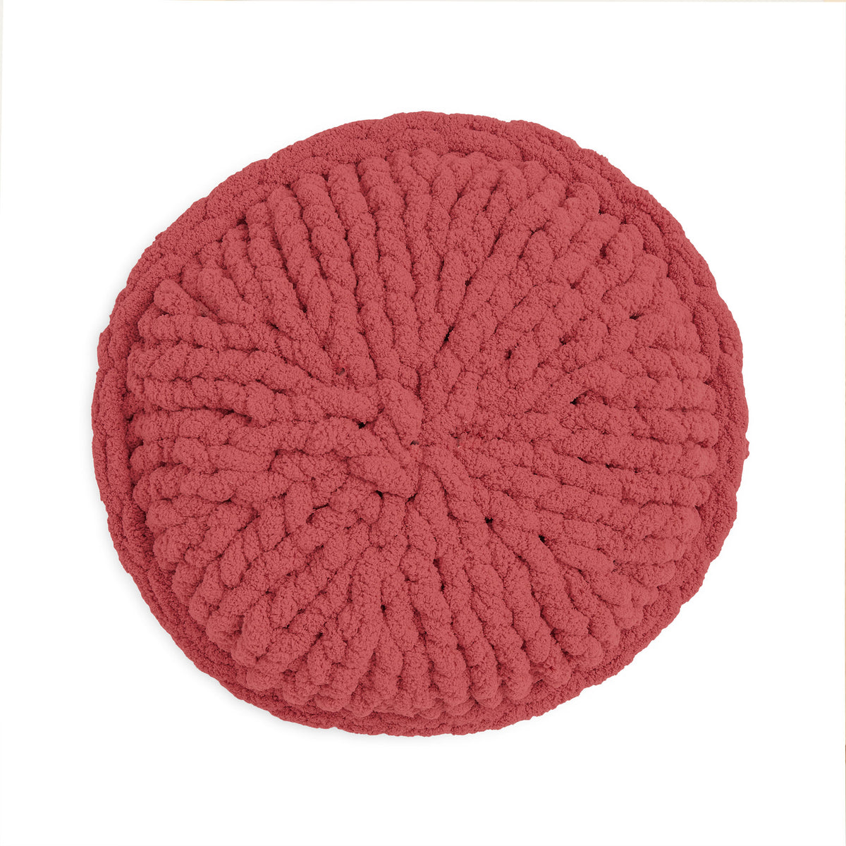 Roundabout Table Knit Pillow made using Bernat yarn on a white background