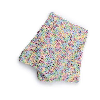 Bernat Simple Ribbing Table Knit Blanket Simple Ribbing Table Knit Blanket made using Bernat yarn in a styled lifestyle setting