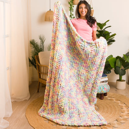 Bernat Simple Ribbing Table Knit Blanket Simple Ribbing Table Knit Blanket made using Bernat yarn in a styled lifestyle setting