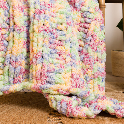 Bernat Simple Ribbing Table Knit Blanket Simple Ribbing Table Knit Blanket made using Bernat yarn in a styled lifestyle setting