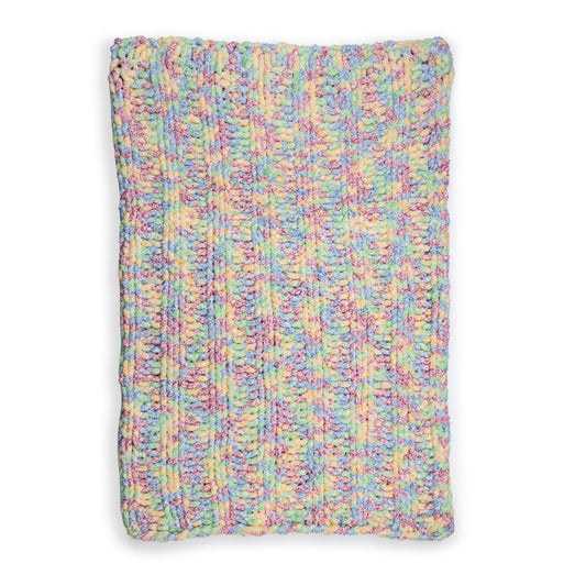 Simple Ribbing Table Knit Blanket made using Bernat yarn on a white background