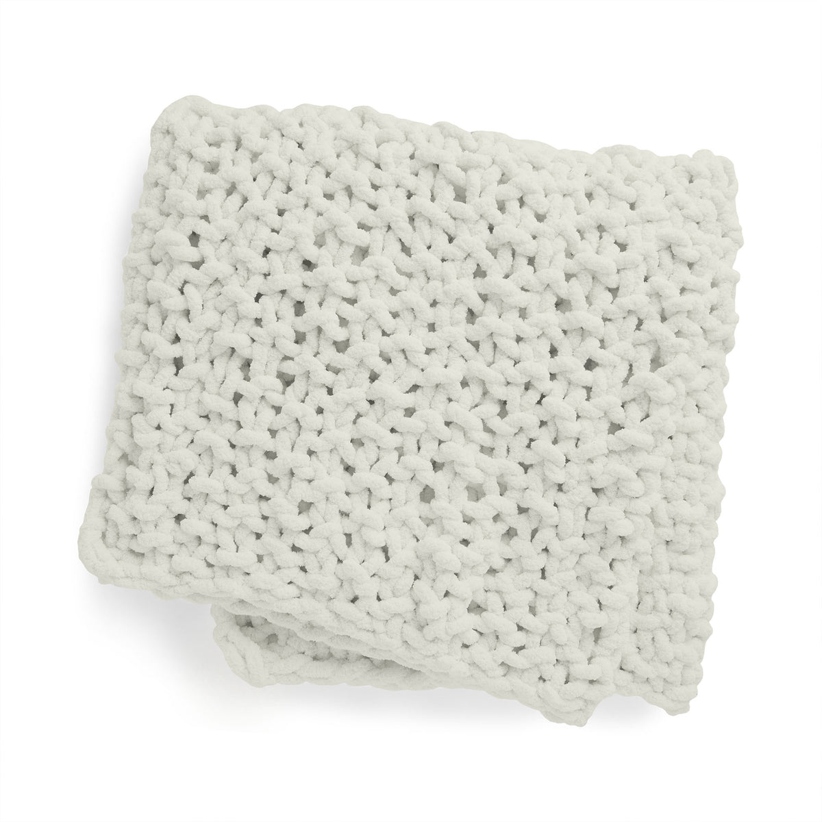 Cozy Does It Seed Stitch Knit Blanket made using Bernat yarn on a white background