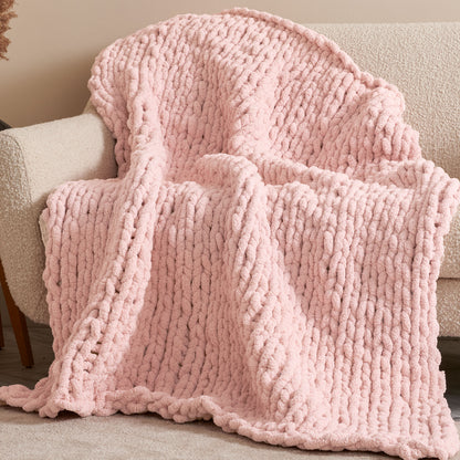 Bernat Nap Trapped Stocking Stitch Knit Blanket Nap Trapped Stocking Stitch Knit Blanket made using Bernat yarn in a styled lifestyle setting
