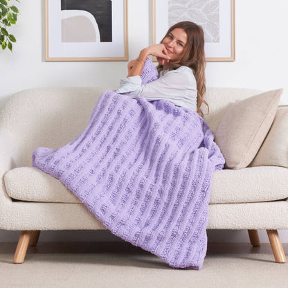 Bernat Triple Slip Stitch Ruffle Ribbed Knit Blanket Triple Slip Stitch Ruffle Ribbed Knit Blanket made using Bernat yarn