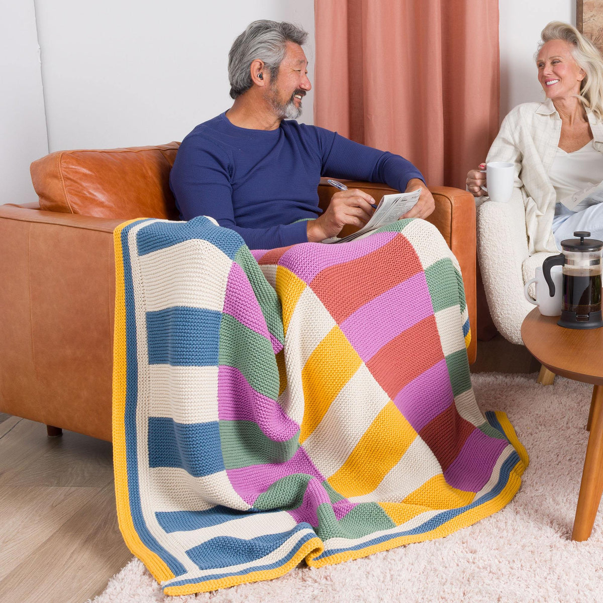 Harmonious Stripes Garter Knit Blanket made using Bernat yarn